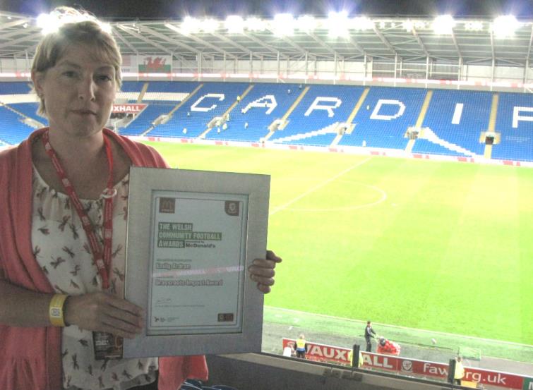 Emily Ardran with her Grass Roots award from the Football Trust